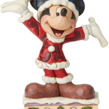 Mickey als Weihnachtsmannfigur auf einem kleinen Sockel