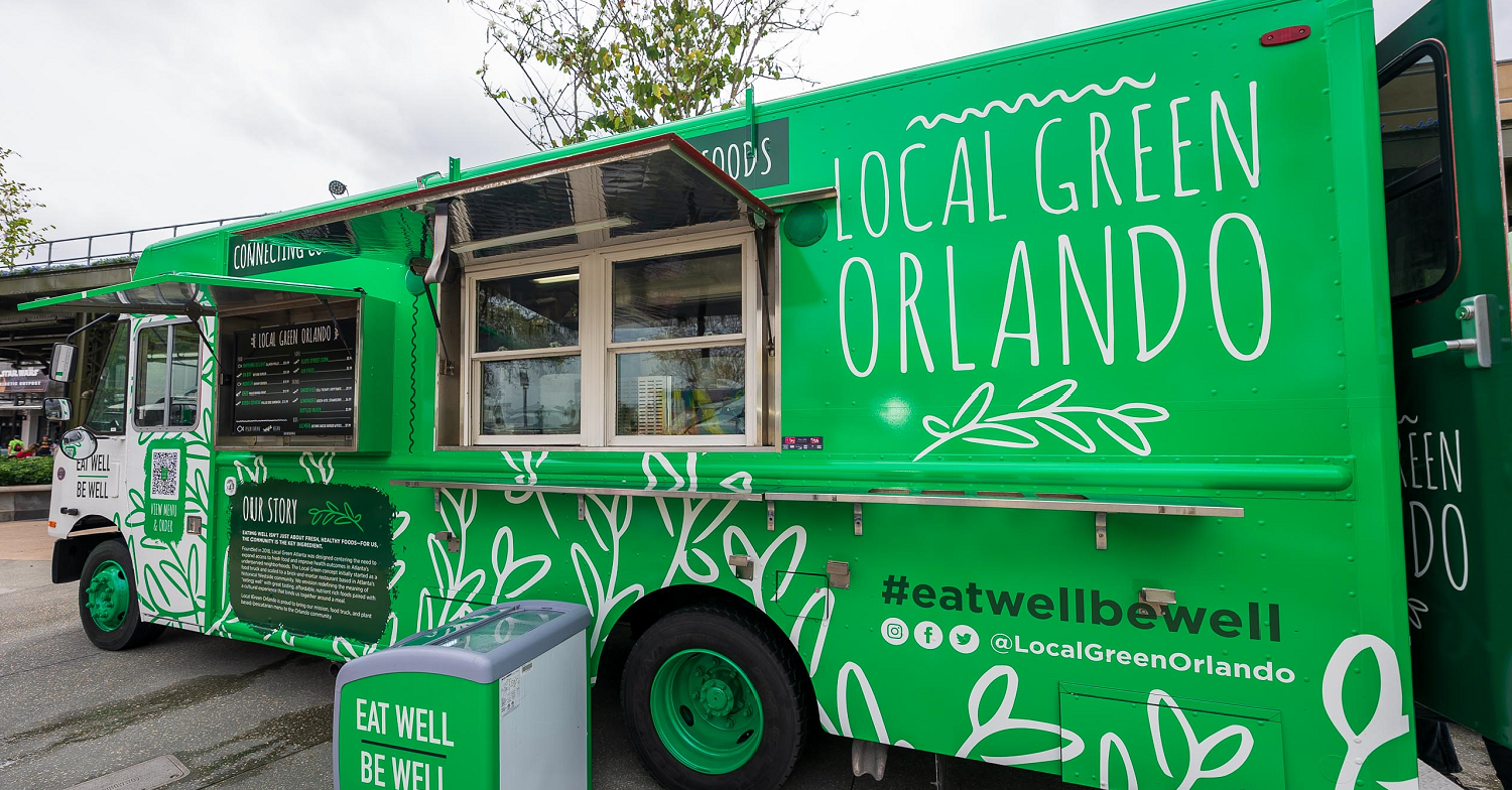 Ein grüner Food Truck in Disney Springs